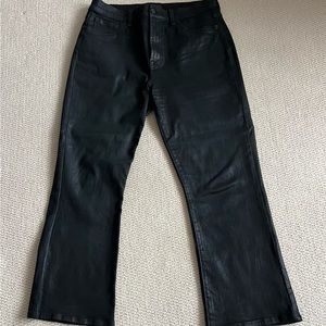 7 For All Mankind black waxed jeans. Worn by 5’0”woman. Inseam 25”.
